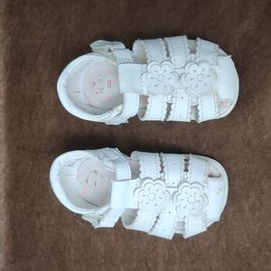 A charming pair of white sandals